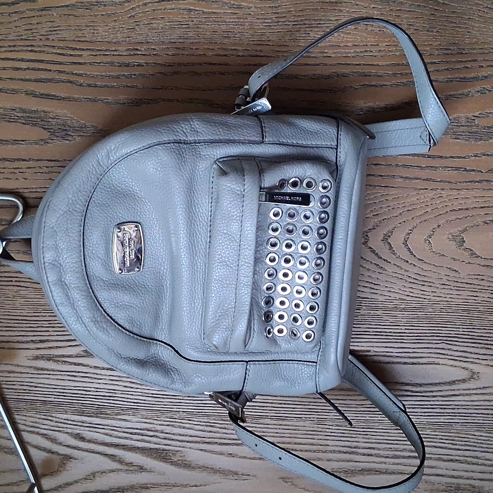 Stylish Gray Backpack with Silver Accents